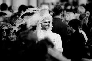 Venice - Man in white carnival costume in St. Mark's Square, black & white landscape photo