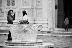 Venice, Italy - people in San Zaccaria square, black and white photo