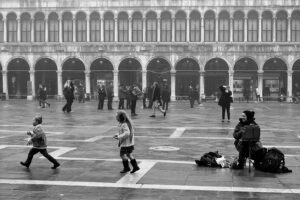 Venice - painter in St. Mark's square, black and white landscape photo